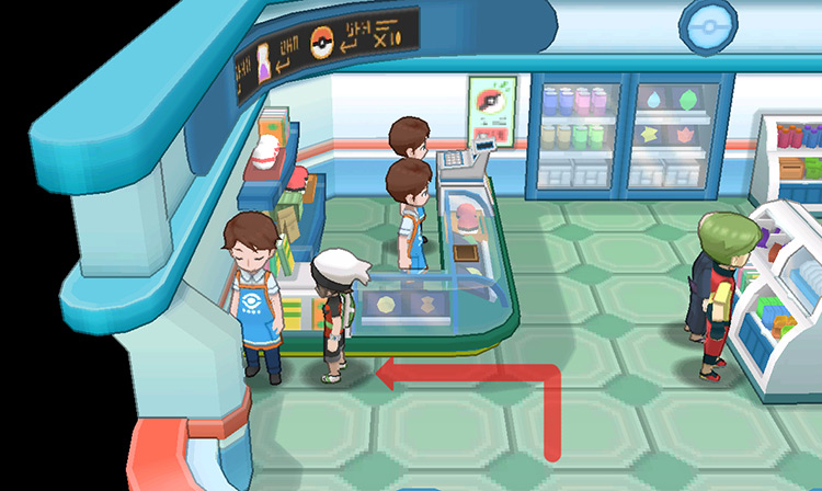Talking to the clerk in front of the counter.
